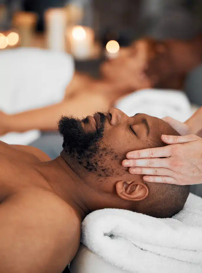 black man at massage therapy for Stress Reduction and Relaxation