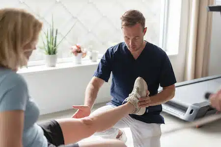 Doctor doing a pain relief management to a injured woman