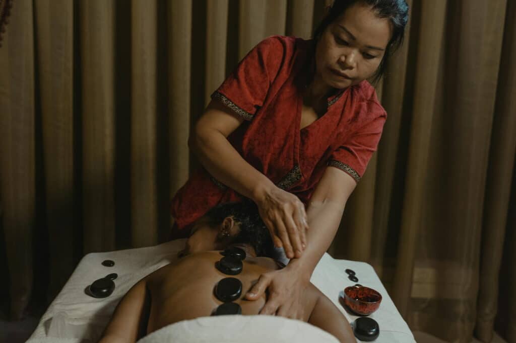 A Woman doing thai Massage in a Person